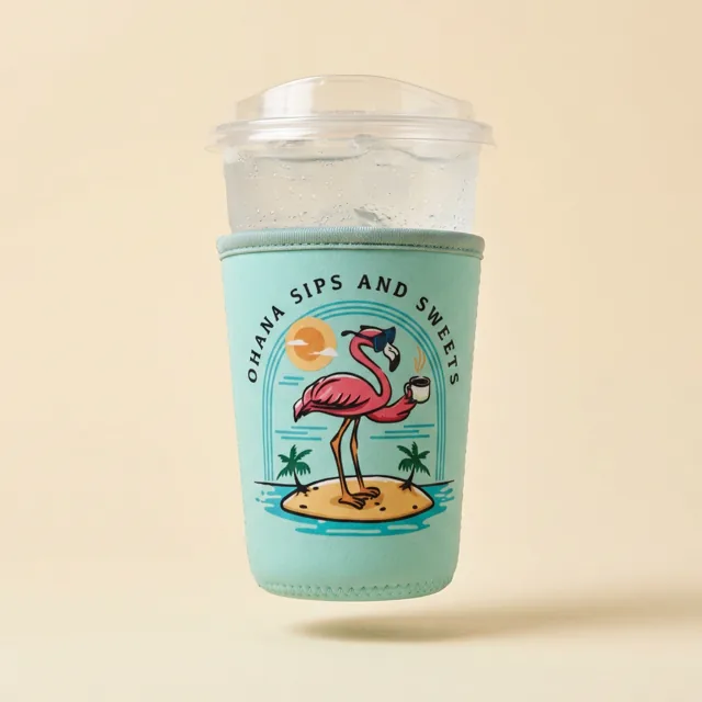 Mint sleeve printed with a flamingo logo on a clear iced drink cup