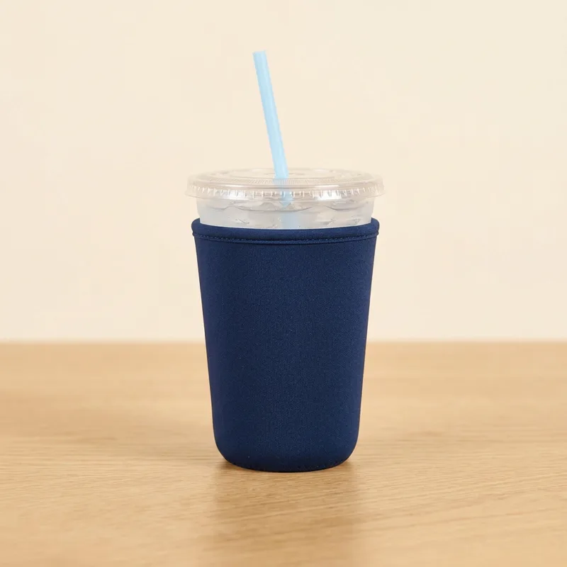 Navy medium drink sleeve on a 24 oz iced cup