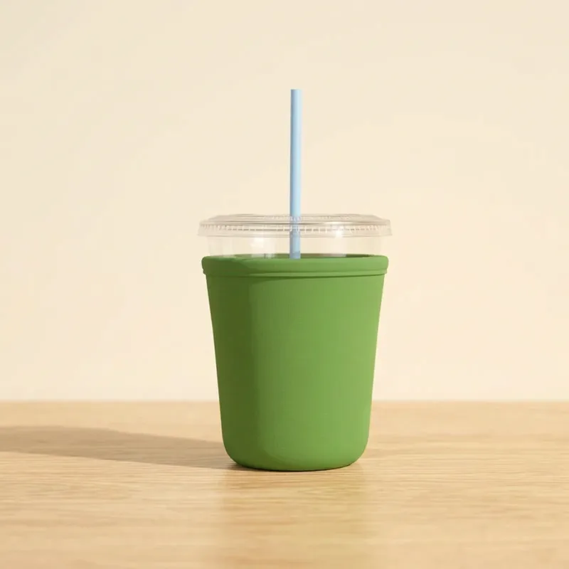 Green small drink sleeve on a 16 oz iced cup