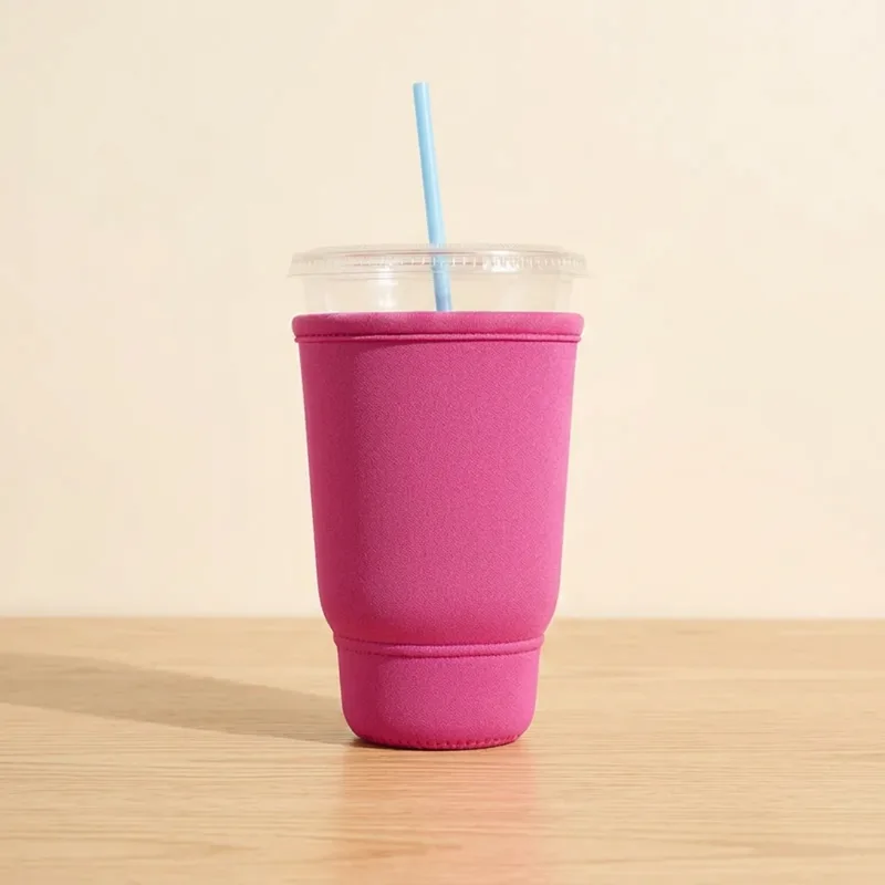 Hot pink XLB drink sleeve on a 44 oz iced cup