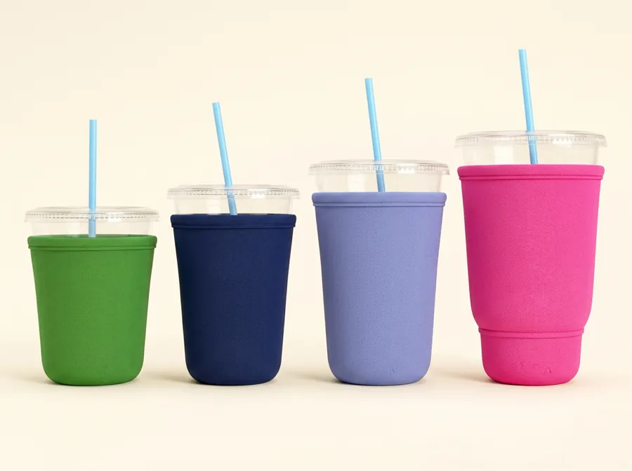 Small green, medium navy, large SW periwinkle, and XLB pink drink sleeves on cups with straws